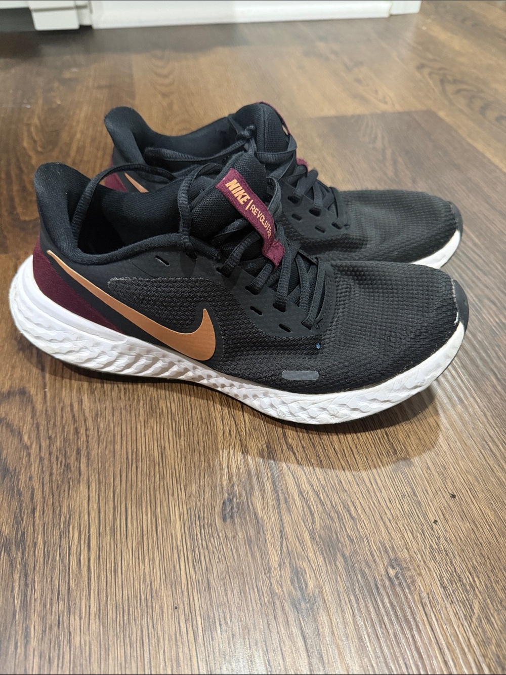 Nike Black Mesh Running Shoes with Copper Swoosh and Maroon Accents